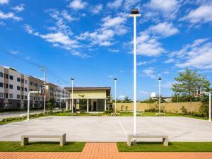 a basketball court with two benches in front of a building at Modern Japandi Studio with Pool Near Mactan Airport in Bankal +44 photos