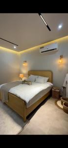a bedroom with a large bed in a room at Noya Chalet in Rumays