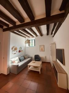 a living room with a couch and a table at La Casuca in Riaza