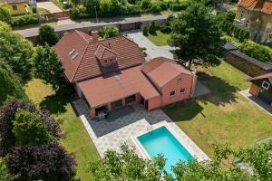 an overhead view of a house with a swimming pool at Vila v Lahošti in Teplice