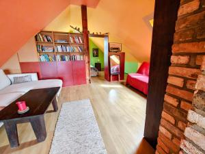 a room with a bed and a book shelf at Haus 9 am Fluss in Witnica