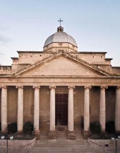 a large building with a cross on top of it at Il Carrubo in Massafra
