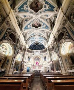 a large church with wooden pews and ceilings at Il Carrubo in Massafra