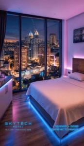 Llit o llits en una habitació de SkyTech Most City Hotel 19 floor PANORAMIC VIEW
