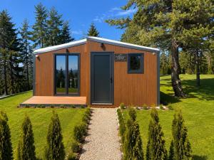 a tiny house on a hill with a garden at Oaza mira Zlatibor, Tornik - ENTIRE HOME at Ski Centar Tornik in Tornik