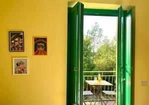 a room with a door open to a patio with a table at Podere Cafasso Country House in Paestum
