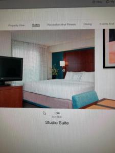 a rendering of a bedroom with a bed and a tv at Residence Inn in Maumee