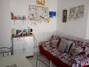 a living room with a couch and a table at Casa Mary in Lavello