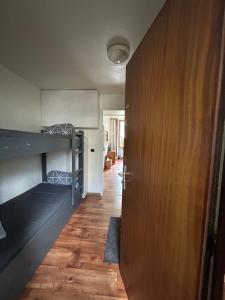 a room with two bunk beds and a door at Abeille de Chamonix in Chamonix