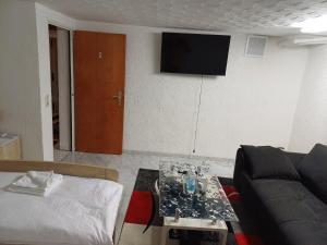 a living room with a couch and a table at Guest house in Datteln 2 in Datteln