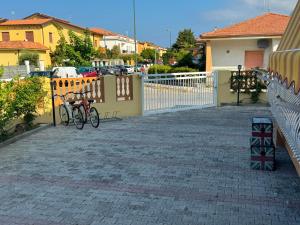 a couple of bikes parked next to a fence at DE ROSA'S home 4 in Praia a Mare