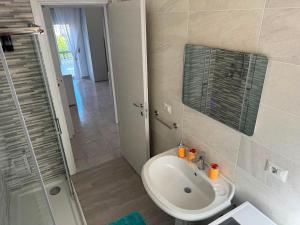 a bathroom with a sink and a shower at DE ROSA'S home 4 in Praia a Mare +7 photos