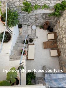 an overhead view of a stone house with potted plants at Murter-Sun Stone House in Murter