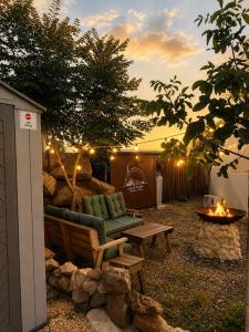 a backyard with a couch and a fire pit at AL-hakoura in Mas'ada +8 photos