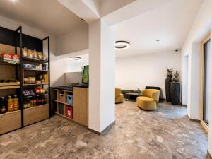a living room with a couch and a table at BASE Achensee - Opening August 2026 in Achenkirch +84 photos
