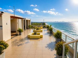 a balcony of a hotel with a view of the ocean at Beachfront Sky Studio with Ocean View in Wattala