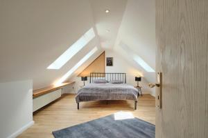 a bedroom with a bed in a attic at Ferienwohnung 12 Monkeys in Stuhr