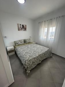 a bedroom with a bed and a window at Apartment Petar in Kotor