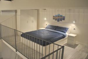 Tempat tidur dalam kamar di Smart Central Apartments San Gregorio