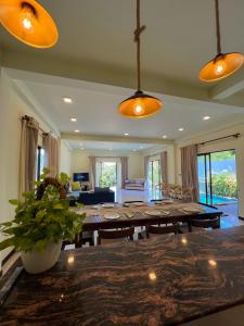 a living room with a large dining room table at Ruchi Villa in Wadduwa