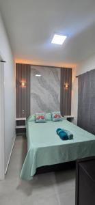 a bedroom with a large bed in a room at Roca Madryn in Puerto Madryn