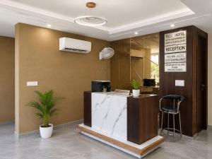 a lobby with a reception desk in a building at Collection O Guru Nanak Dev University Amritsar Formerly Hotel Tashi in Amritsar