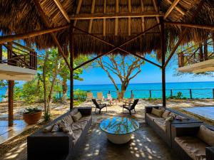 a living room with couches and a view of the ocean at Isla Risa in Cartagena de Indias