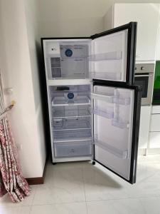 a refrigerator with its door open in a kitchen at Hua Hin, Pool Villa, Nice Breeze 7 in Ban Bo Fai (1)