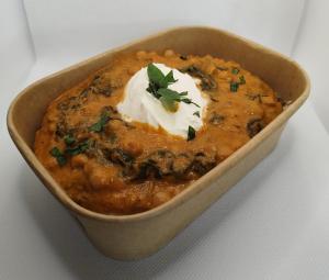 a brown bowl of food with sour cream andilantro at Farmhouse B&B in Saint-Georges
