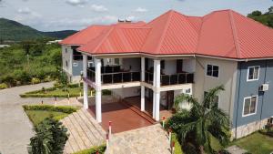 an aerial view of a house with a red roof at Snl Mountain View Hotel in Oko Sombo