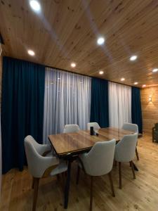 a conference room with a wooden table and chairs at Villa cottage D3 in Zeda Ulianovka