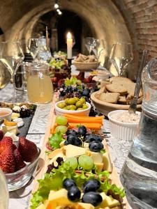 a long table filled with different types of food at Apartmán vinařství U Krčků in Zaječí