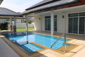 a swimming pool in the backyard of a house at Hua Hin, Pool Villa, Nice Breeze 7 in Ban Bo Fai (1)