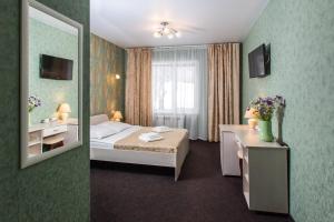 Кровать или кровати в номере Отель Респект