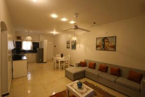 a living room with a couch and a table at calming valley in Luxor