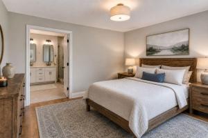 a bedroom with a bed and a bathroom at Alpine Haven Getaway in Vail