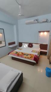 a bedroom with a large bed in a room at Hotel adiraj palace exclusive in Ahmadnagar