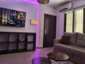 a living room with a couch and a table at Los BOLICHES Playa in Fuengirola +29 photos