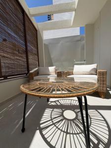 a coffee table in a room with a couch at House 29 Suites in Heraklio