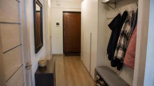 a hallway with a door and a couch in a room at Dream Stay in Schwanewede