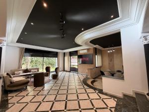 a lobby with couches and a table in a building at Villa Anfa in Casablanca