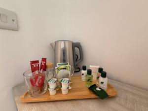 a wooden cutting board with a coffee maker and ingredients at Brook Terrace in Darlington