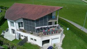 an aerial view of a house with a deck at L'Aquarium Attigneville in Attignéville