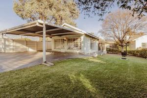 a large white house with a garage at Hephzibah Manor in Alberton