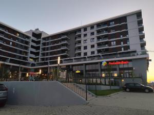 a large building with a skate ramp in front of it at Velvet Point apartmant in Kragujevac