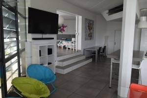 a living room with a flat screen tv on a wall at L'Aquarium Attigneville in Attignéville +27 photos