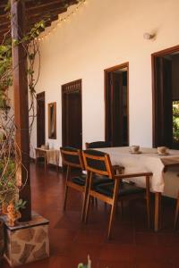 a dining room with a table and chairs at La Casona Santa Fe in Santa Fe de Antioquia