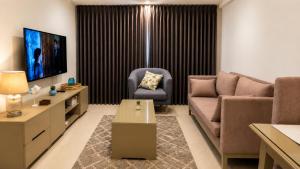a living room with a couch and a chair at Beachfront Sky Studio with Ocean View in Wattala