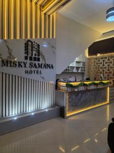 a lobby of a hotel with a sign that reads music samana hotel at Misky Samana Hotel in Espinar