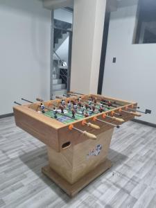 a foosball table with a chess board on it at Misky Samana Hotel in Espinar